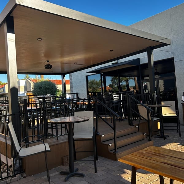 Moon Valley Grill & Patio's outdoor seating area with tables, chairs, and a covered patio.